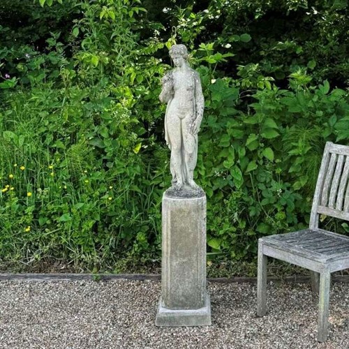 Girl Holding Dove on Tall Pedestal