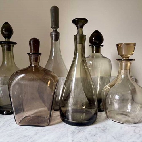 Cluster of Scandinavian Mid Century smoked glass decanters