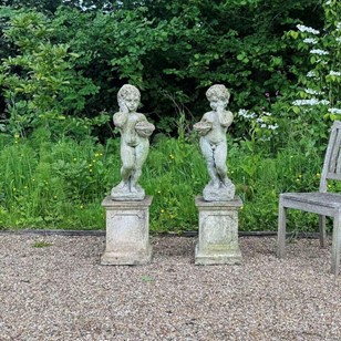 Pair of Weathered Cherubs on Pedest...