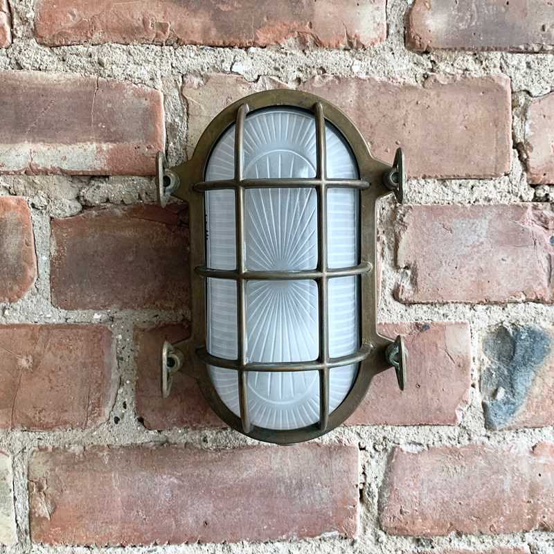 Contemporary Aged Brass Oval Bulk Head Wall Lights-agapanthus-interiors-contemporary-italian-aged-brass-oval-bulk-head-wall-light-4-main-638231289336577968.jpeg