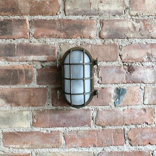 Contemporary Aged Brass Oval Bulk Head Wall Lights