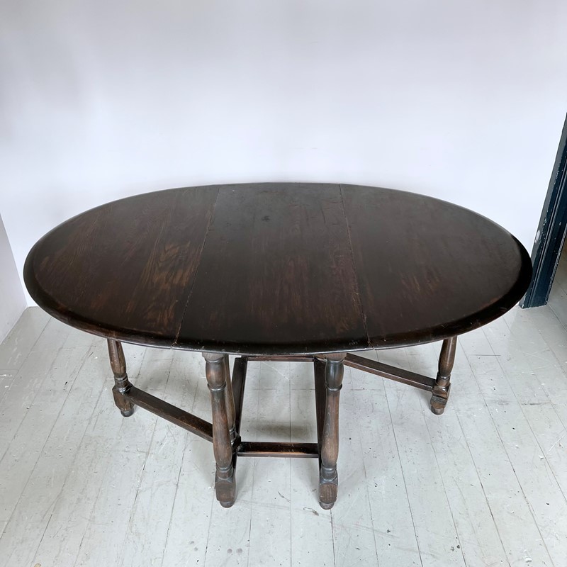 Dark Stained Solid Wood Oval Drop Leaf Table-agapanthus-interiors-dark-stained-solid-wood-oval-drop-leaf-table-3-main-638011804279384871.jpeg