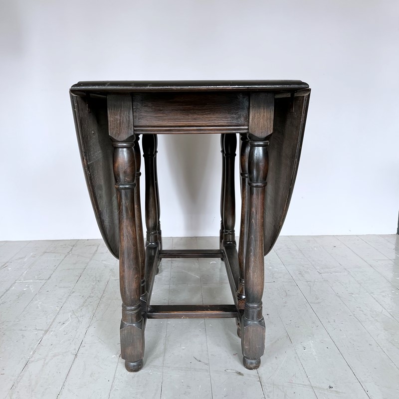 Dark Stained Solid Wood Oval Drop Leaf Table-agapanthus-interiors-dark-stained-solid-wood-oval-drop-leaf-table-5-main-638011804344540024.jpeg