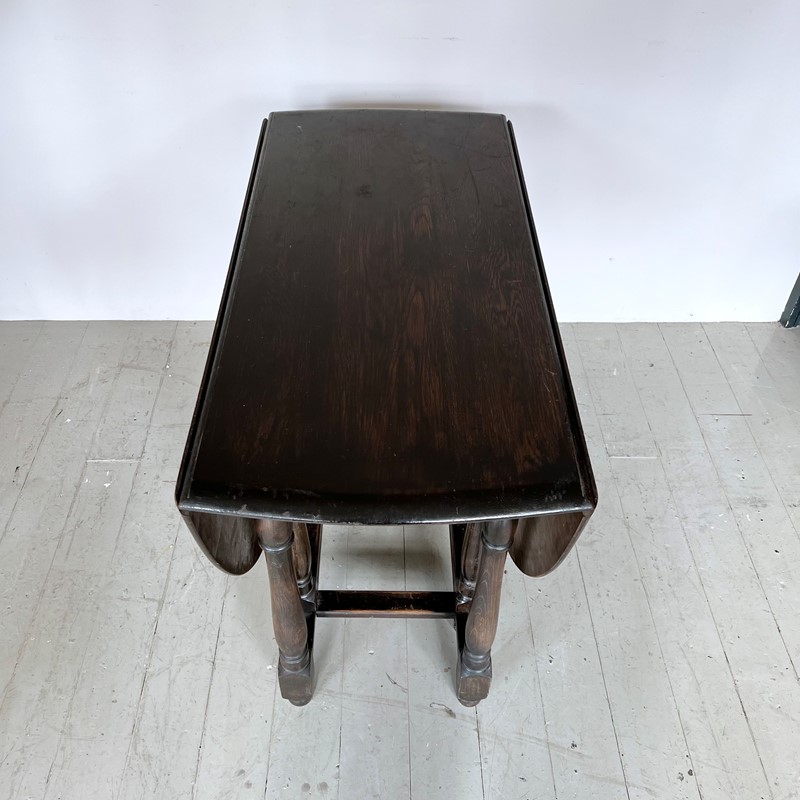 Dark Stained Solid Wood Oval Drop Leaf Table-agapanthus-interiors-dark-stained-solid-wood-oval-drop-leaf-table-6-main-638011804375320806.jpeg