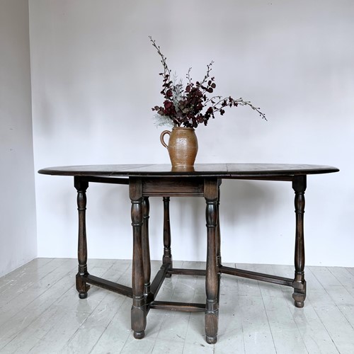 Dark Stained Solid Wood Oval Drop Leaf Table