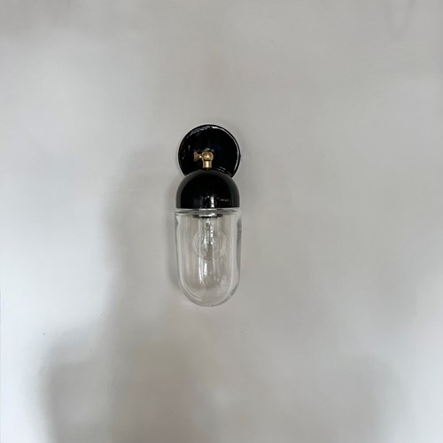 Contemporary Wall Light, Balck Fitting And Clear Glass Shade