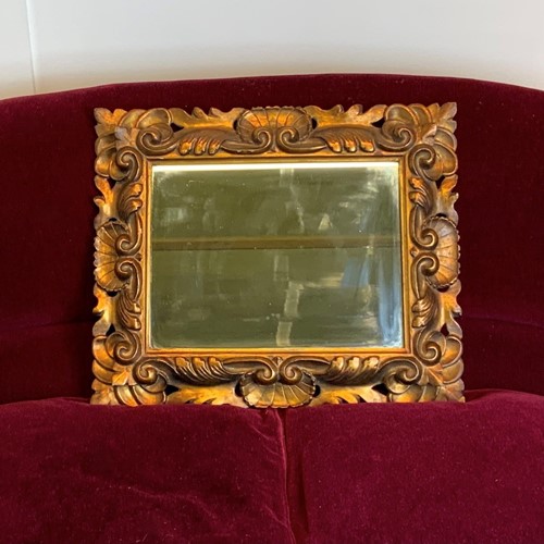 Carved and gilded mirror