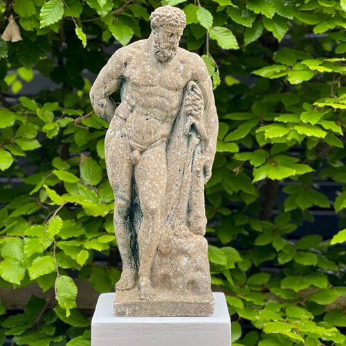 Hercules Statue On Weathered Pedestal