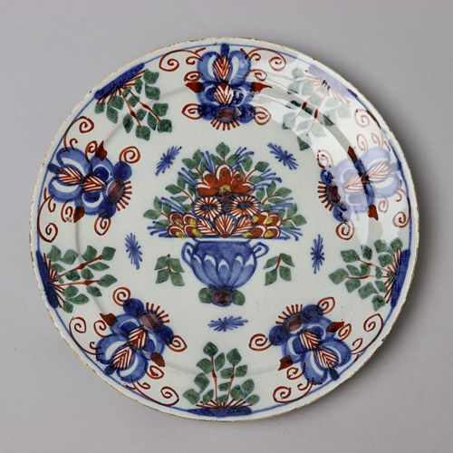 Polychrome Delft Plate Decorated With An Urn Of Flowers