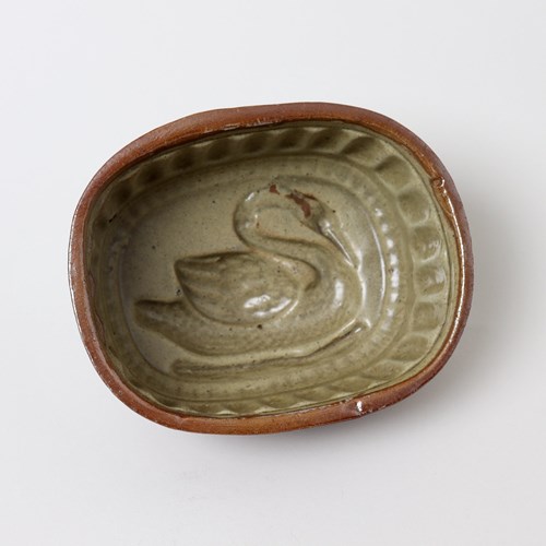 Brown Saltglaze Jelly Mould With Swan To Base