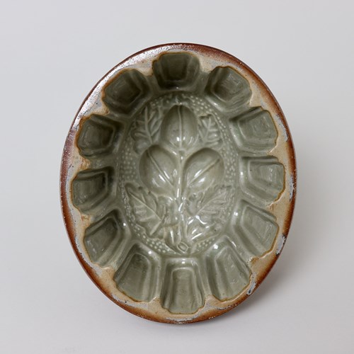 Brown Saltglaze Jelly Mould With Plums To Base