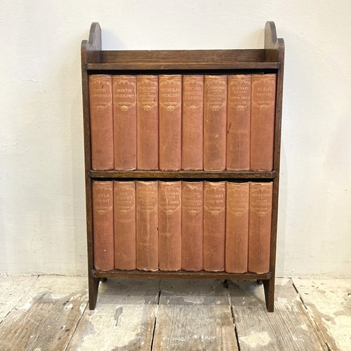 Antique Dickens Collection On Oak Shelf