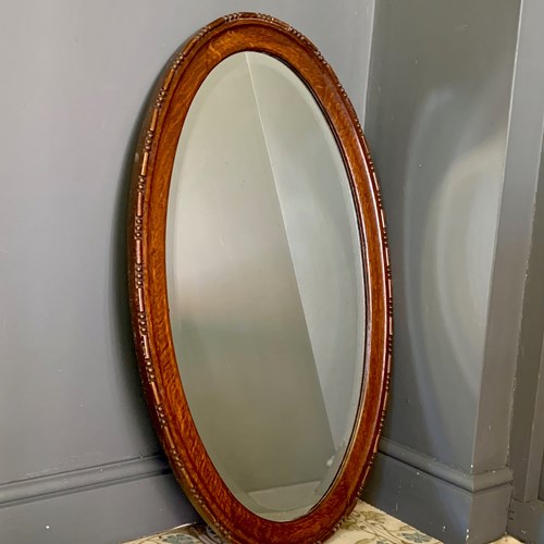 Oval Carved Wooden Mirror With Bevelled Glass