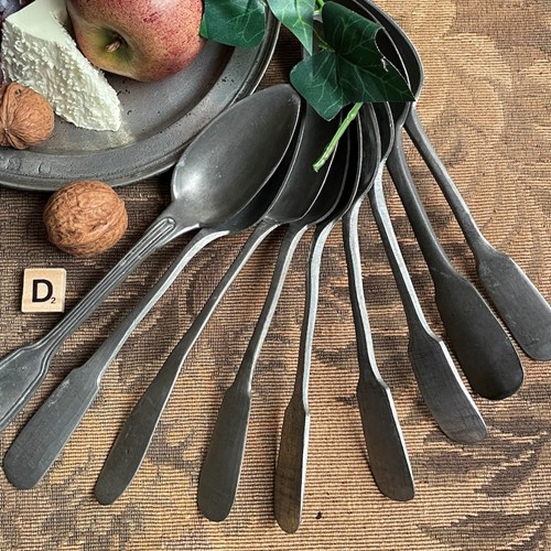 A Harlequin Set of 9 Large Pewter Spoons