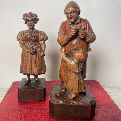A Pair Of Carved Figures