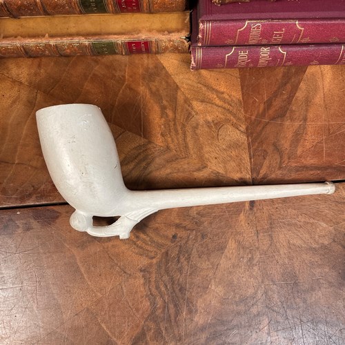A Large Clay Pipe With Football Boot And Ball