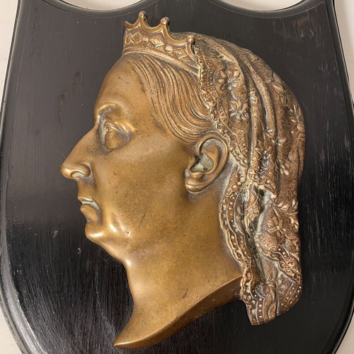 A Large Brass And Wood Plaque Of Queen Victoria 