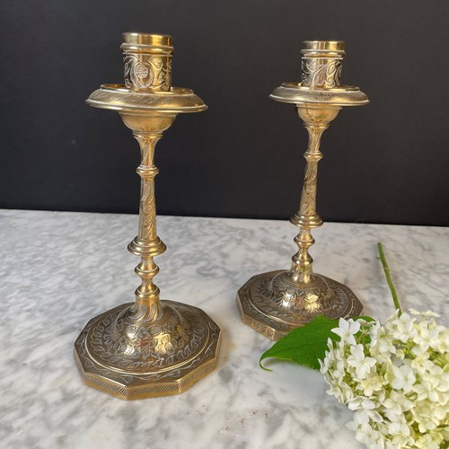 A Pair Of Indian Brass Candlesticks