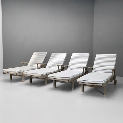 Four Teak Loungers