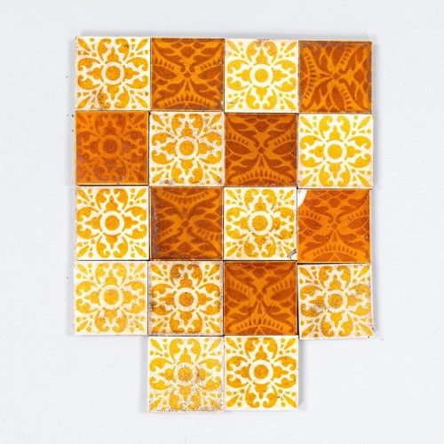 Antique set of glazed patterned tiles