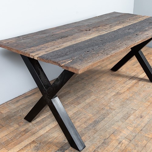 Striking metal and reclaimed teak table