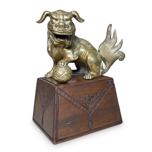 Brass Cast Foo Dog Mounted On A Hardwood Stand