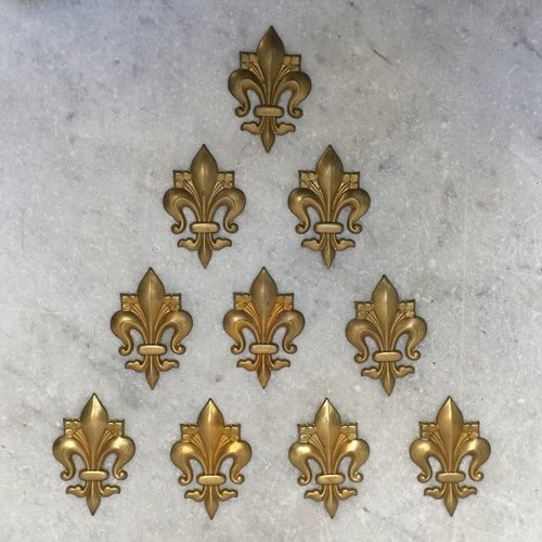 Set Of Ten Brass 'Fleur De Lis' Applique Mounts