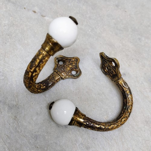 Pair Of Late 19Th Century Brass And Ceramic Hooks