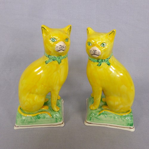 Pair Of Yellow Staffordshire Cats