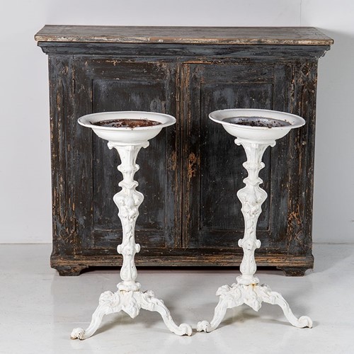 A pair of victorian cast iron torchere plant stand
