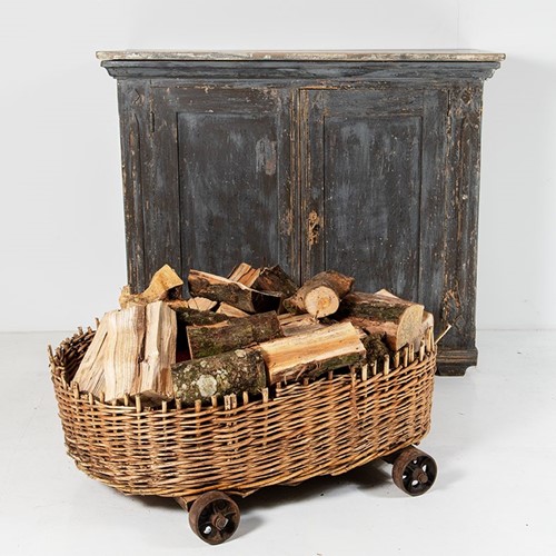 Large wicker dog bed log basket - cast iron wheels