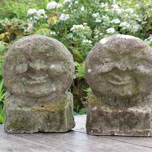 Pair of Weathered Concrete Heads