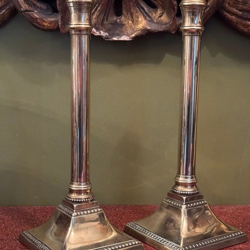 Pair Of Georgian Brass Column Candlesticks