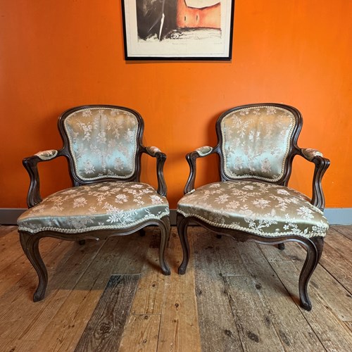Pair Of Antique French Walnut Fauteuils In Louis XV Style