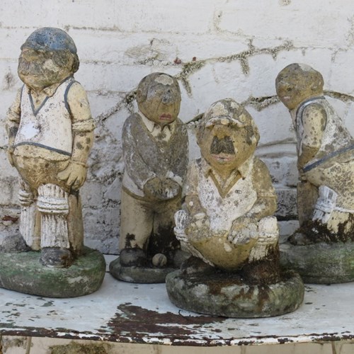 Set Of Four Weathered Garden Cricketers Statues