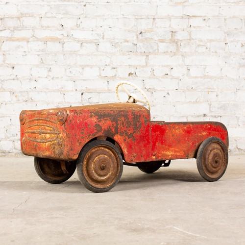 Vintage tin 'barn find' pedal car