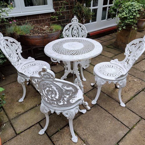 Heavy Cast-Iron Set Of Garden Table And Four Chairs