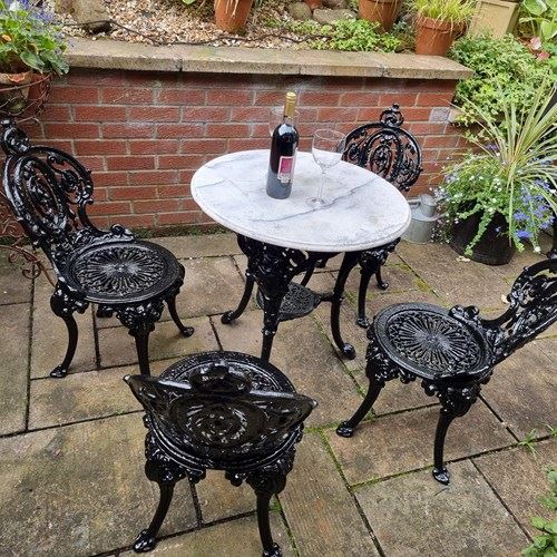 Heavy Cast-Iron Set Of Garden Table And Four Chairs