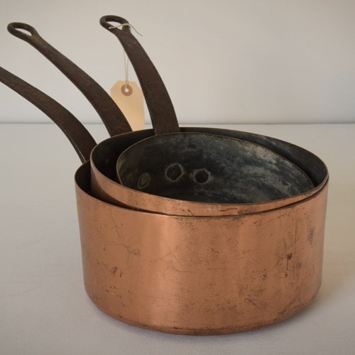 Set Of Three - Copper And Iron Handled Saucepans