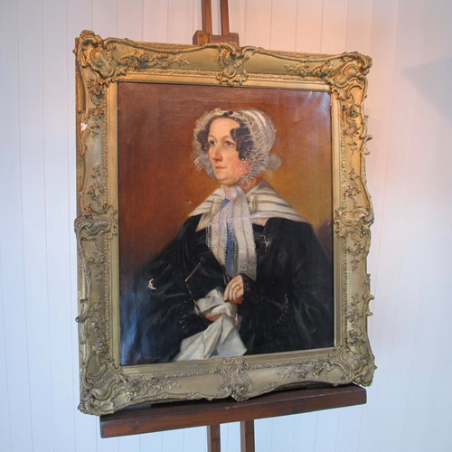 Large Victorian portrait of woman in lace bonnet