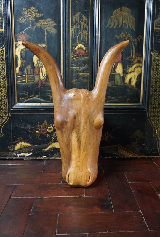 A carved head of an ox-no43collectables-dsc026232-main-637837233732332263.JPG