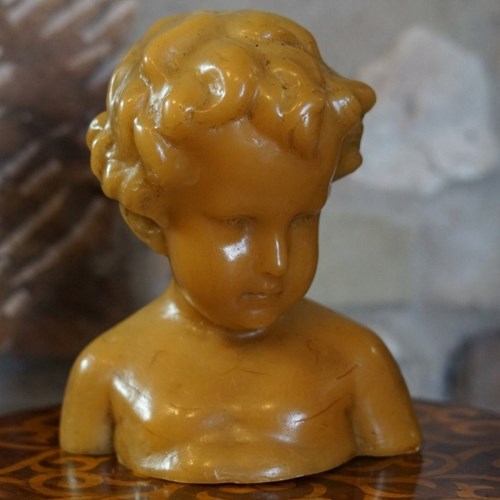 A Charming French Wax Bust Of A Child.