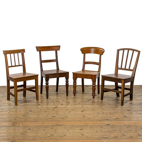 Harlequin Set Of Four Antique Oak Chairs