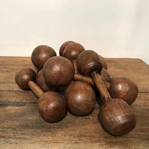 A set of wooden dumbbells, 