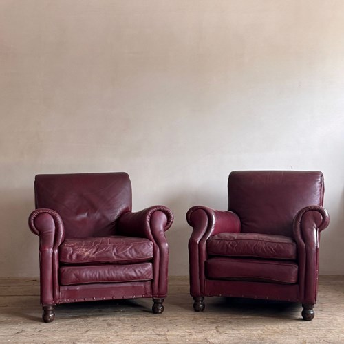 A Pair Of Red Leather Club Chairs