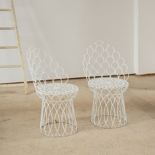 A Pair Of Scalloped Iron Peacock Chairs 