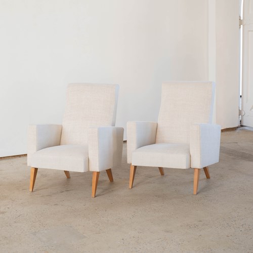 A Pair Of Mid Century Armchairs In A Natural Hemp