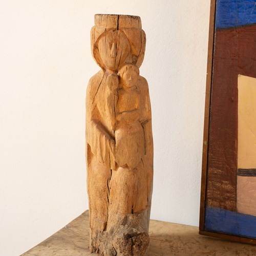 Rustic Wooden Sculpture Of A Mother And Child