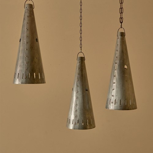 Trio Of 20Th Century Patinated Steel And Copper Rivet Conical Pendant Lights