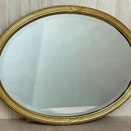 Early 20Th Century Oval Framed Gilt Wall Mirror With Bevelled Glass